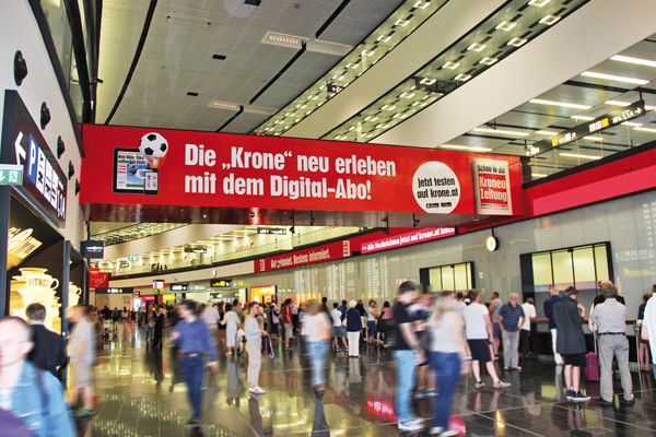 Bridge in the building of the Vienna International Airport with "Kronen-Zeitung" advert